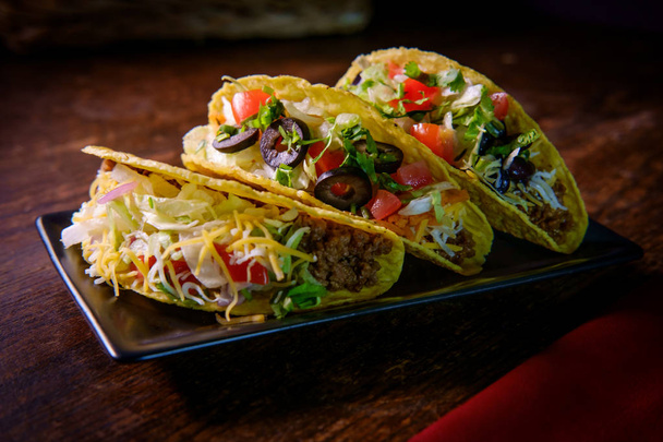 Spice Up Your Fiesta with Irresistible Crunchy Tacos and Flavorful Fixings